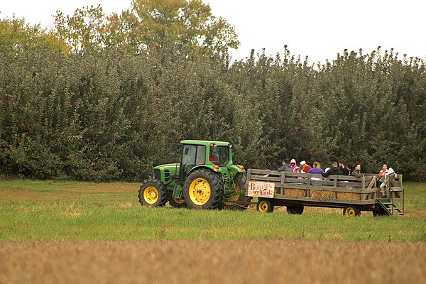 During the autumn months, hayrides and apple picking (as pictured here) are among many popular recreational activities for township residents, along w