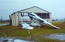 Destruction to an airplane hangar in Belize Hurricane Keith damage belize (198083347).jpg