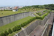 配水塔から名東区東部を望む。下の空地は配水池（1号配水池と2号配水池）である。