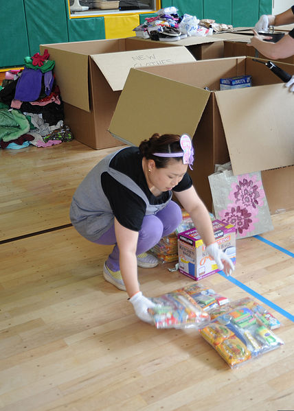 File:Kumiko Fukui, from Misawa, Japan, sorts care packages donated to Japan by listeners of the "Ron and Don" radio show at Naval Air Facility Misawa, Japan, June 23, 2011 110623-N-TW583-022.jpg