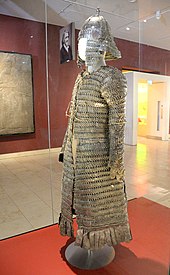 Lamellar coat and helmet. From Tibet, in modern-day China. 14th-17th century CE. Iron, leather, and textile. Presented by Lieutenant Colonel Sir Francis Younghusband. Discoveries Gallery, National Museum of Scotland