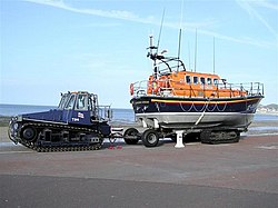 Llandudno's previous Mersey-class lifeboat, while sat on its transport trailer, with sea-tow Talus MB-H tractor Llandudno Lifeboat - geograph.org.uk - 163441.jpg