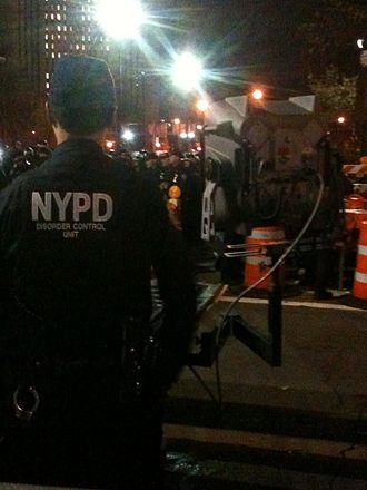 An NYPD officer stands ready with the LRAD 500X at an Occupy Wall Street protest on November 17, 2011 near the city hall Long Range Acoustic Device 500X in New York City.jpg