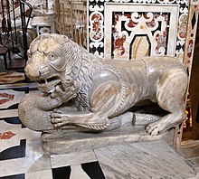 One of the four marble lions, once supporting the Ambo of Guglielmo, now located at the feet of the presbytery balustrade Maestro guglielmo, pulpiti (originariamente uniti) dal duomo di pisa, 1159-1162, leoni stilofori oggi presso il presbiterio 02.jpg