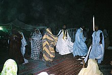 Dancing guests at a wedding party in Mauritania Mauritanian wedding party.jpg