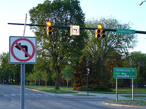 Signage at a Michigan left intersection. Two l...