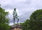 This statue is known as The Lexington Minuteman is commonly believed to depict Captain John Parker. It is by Henry Hudson Kitson and stands at the town green of Lexington, Massachusetts. Minute Man Statue Lexington Massachusetts.jpg