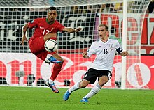 Full-back Philipp Lahm (right) marks winger Nani.