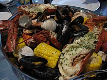 A New England clam bake consists of various steamed shellfish. New England clam bake.jpg