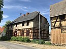 Homestead, consisting of a residential house, building with upper arbor, gate and stable