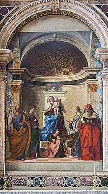 Oil painting. A large altarpiece in which the Madonna sits on a raised throne, with four saints and an angel as described in the article.