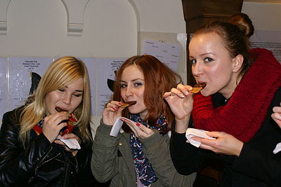 Women eating biscuits in England