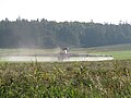 Postřikovač na poli ve Vojníkově. Okres Písek.} English: Field sprayer on the field in Vojníkov village, Písek District, Czech Republic.