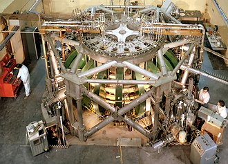 Overhead view of the Princeton Large Torus in 1975. PLT set numerous records and demonstrated that the temperatures needed for fusion were possible. Princeton Large Torus 1975.jpg