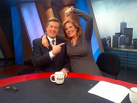 Tory seated at a television studio set with Sandra Pupatello in January 2013