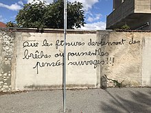 Photographie d'un graffiti sur un mur