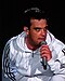 Colour photograph of Robbie Williams performing live in 2006.