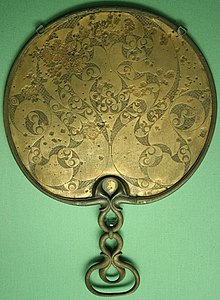 A 1st century BCE mirror found in Desborough, England, showing the spiral and trumpet motif Romano-Celtic mirror (Desborough).jpg