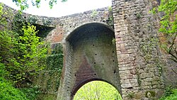 Rosslyn Castle entry bridge. Site of the sketch of Robert Burns by Alexander Nasmyth. Rosslyn Castle, access bridge, Roslin, Midlothian.jpg