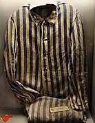 A Sachsenhausen detainee's uniform. The red triangle atop a yellow triangle (at bottom left) marked the prisoner as a Jewish political enemy