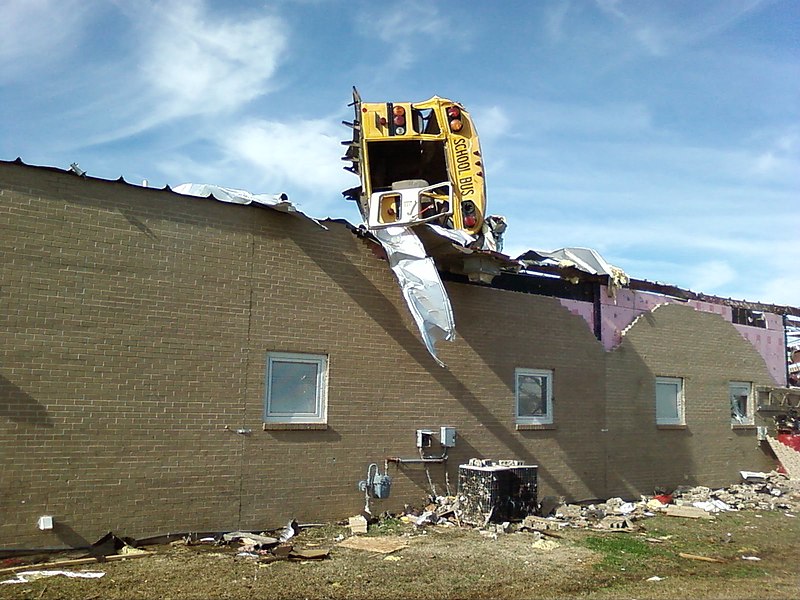 Even heavy vehicles like this school bus are easily tossed around by tornados.