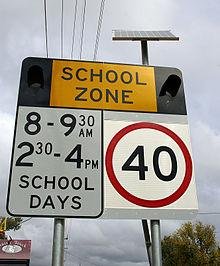 A solar powered school zone sign used in New South Wales, Australia School zone flashing light warning sign.jpg