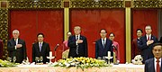 President Trump attends a state dinner Secretary Tillerson and President Trump Stand for the National Anthem at a State Dinner in Vietnam (37624160824).jpg