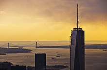 One World Trade Center seen at sunset; the Verrazzano-Narrows Bridge is in the background