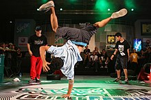 Breaking, an early form of hip hop dance, often involves dance battles, showing off technical skills, trying to out-do a rival dancer, and displaying tongue-in-cheek bravado. Thai Breakdancers.jpg