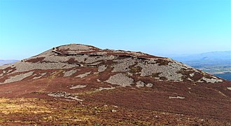Tre'r Ceir (best preserved hillfort in Europe, built 200 BC) from Garn Ganol; April 2022 17.jpg