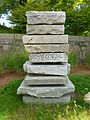 Cairn sculpture with a quote from US Senator Paul Tsongas, located at the south end of the Concord River Greenway near 1000 Lawrence Street, Lowell, Massachusetts. West side of sculpture shown.