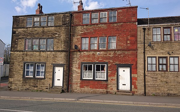 Weavers' cottages in Milnrow, built using sandstone in a style typical of the area. Handloom weaving of woollens was the staple industry during the ea
