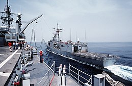 USS Coronado (left) participates in underway replenishment with USS John A. Moore on 1 April 1988.