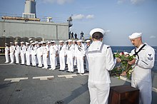 US sailors aboard USS Frank Cable hold a wreath-laying ceremony in honor of Nanggala in 2022 USS Frank Cable (AS 40) holds a wreath laying ceremony in the Java Sea. (52247228456).jpg