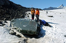 US Navy 040809-N-0331L-002 Recovery personnel examine the wreckage of a Navy P-2V Neptune aircraft that crashed over Greenland in 1962.jpg