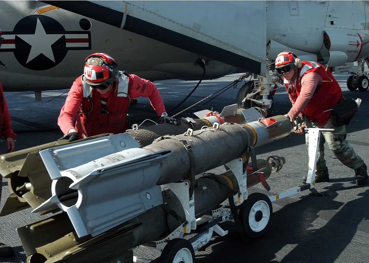 File:US Navy 041004-N-4565G-003 Aviation Ordnancemen move a skid loaded  with three GBU-16 1,000 lb. laser guided bombs across the flight deck  aboard the conventionally powered aircraft carrier USS John F. Kennedy (CV  67).jpg - Wikimedia Commons
