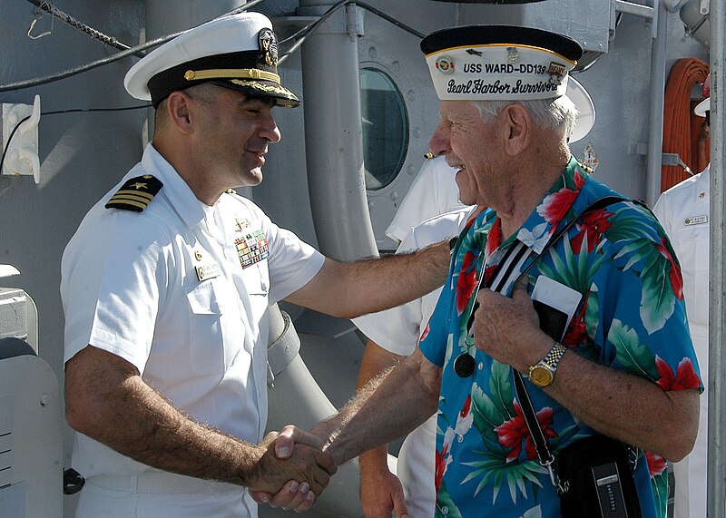 File:US Navy 051205-N-5539C-002 Veterans of the World War II-era Wickes-class destroyer USS Ward (DD 139) are greeted aboard the guided missile frigate USS Crommelin (FFG 37) by the ship's commanding officer, Cmdr. Mark Manfre.jpg