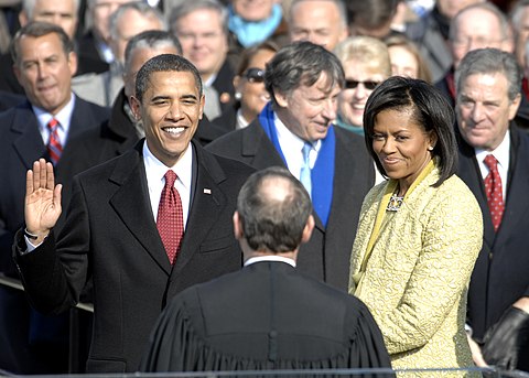 With his family by his side, Barack Obama is sworn in as the 44th president of the United States by Chief Justice of the United States John G. Roberts Jr.