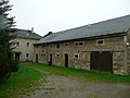 House and side building of a three-sided courtyard