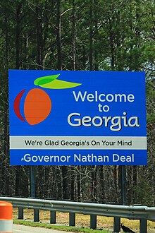 A sign welcoming travelers to Georgia, thanking visitors for having "Georgia on their mind" Welcome to Georgia (33745353310).jpg