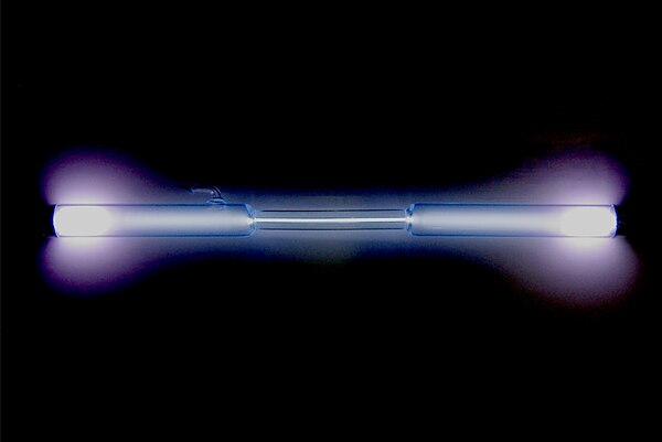 A xenon-filled discharge tube glowing light blue