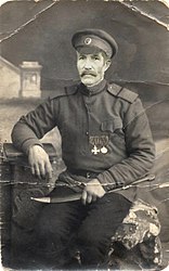 Бомбардир Кровяков Егор Климович, с бебутом артиллериста русской армии, 1914 — 1917 годов.
