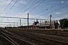 Gare ferroviaire et dépendances (hangar aux marchandises et sanitaires) : façades et toitures, deux anciennes salles d'attente, plafonds de bois à caisson et grilles extérieures primitives