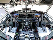 Boeing 737 MAX 8 cockpit. The layout is similar to the 737NG, but the primary flight display is larger, and the navigation display is merged with the multi-function display, eliminating the need for a lower display. 737 Max Cockpit.jpg