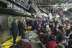 The 34th Street station on the IRT Flushing Line, which opened in September 2015, was toured by then-Mayor Michael Bloomberg in 2013. 7 Line Extension Ceremonia Ride vc.jpg