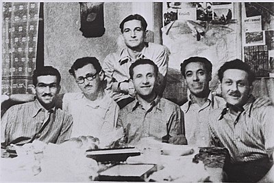 Group of Jewish parachutists, photographed in Bucharest in September 1944. Shaike Dan Trachtenberg is center, seated, with Baruch Kamin to his left