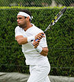 Alejandro Falla competing in the first round of the 2015 Wimbledon Qualifying Tournament at the Bank of England Sports Grounds in Roehampton, England. The winners of three rounds of competition qualify for the main draw of Wimbledon the following week.