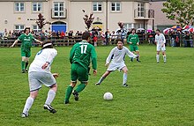 Men playing association football in Kilkenny, Ireland (2007) Amateur Football in Kilkenny-Ireland.jpg