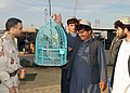 An Afghani villager shows his pet bird to US Air Force (USAF) Technical Sergeant (TSGT) John Dendy, from the Air Force News Agency (AFNA) - DPLA - 6fb891605df4217281afb56a788b05f4.jpg