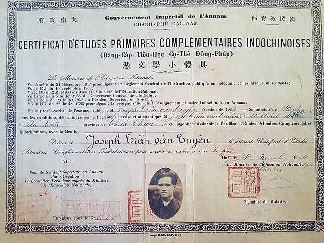 An Indochinese primary school completion certificate (Bằng-Cấp Tiểu-Học Cụ-Thề Đông-Pháp) issued by the National Ministry of Education of the Nguyễn d